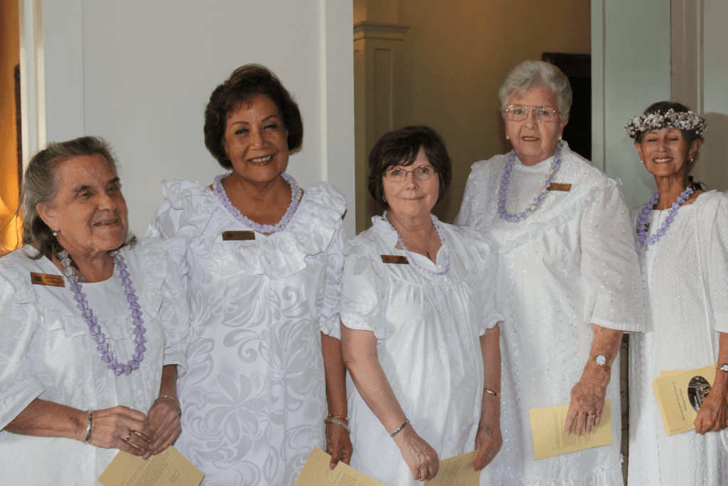 Five female Washington Place Docents in white dresses